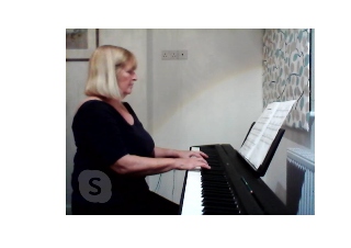 Image of pupil Lynette practising on a digital piano